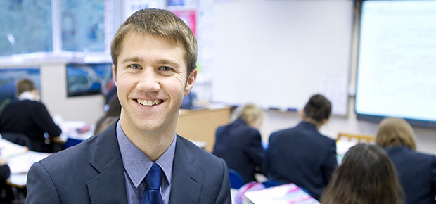 Image of a male teacher looking at the camera