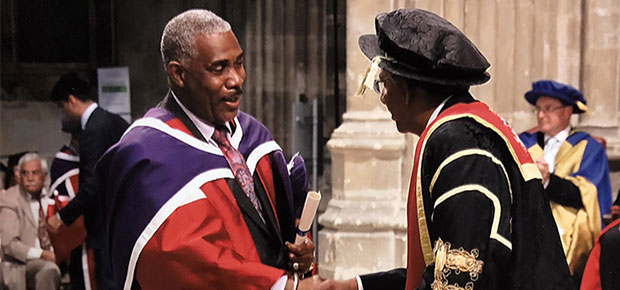 Image of a man receiving their doctorate